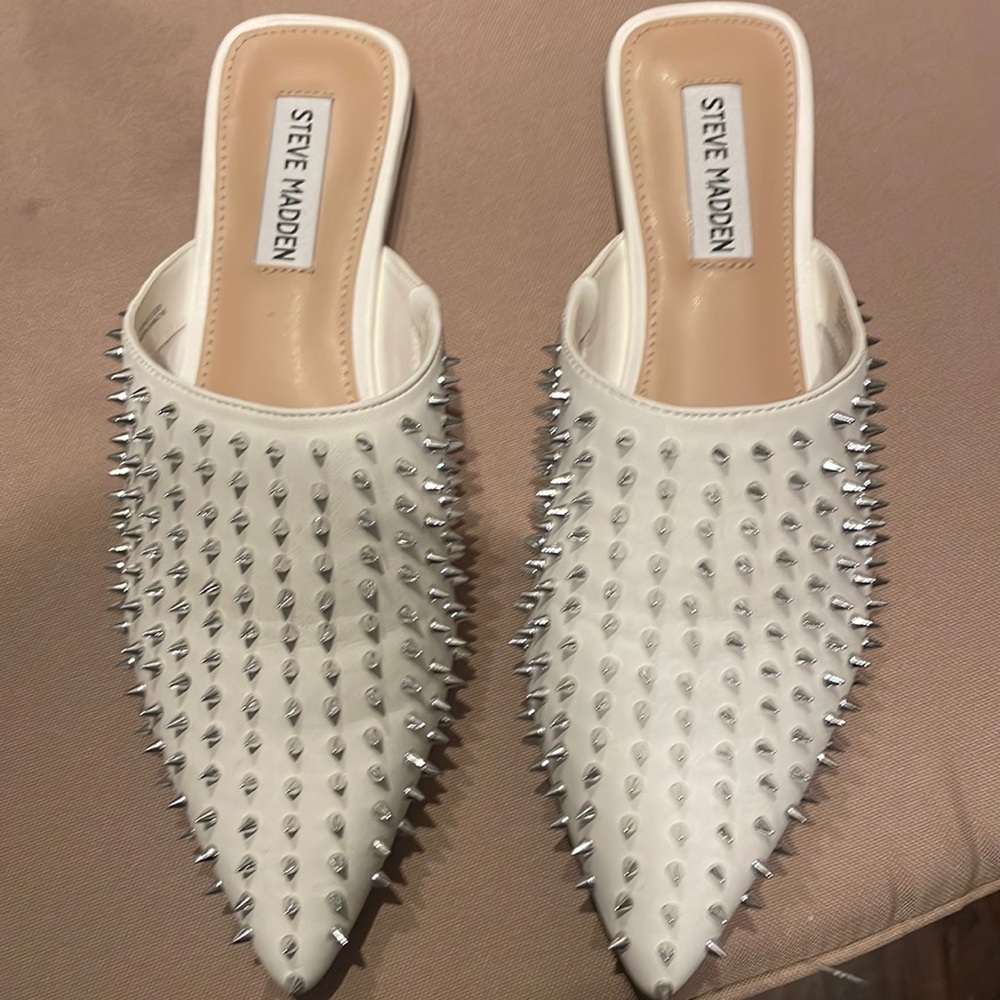 Flat shoes brand new never worn. With silver spikes